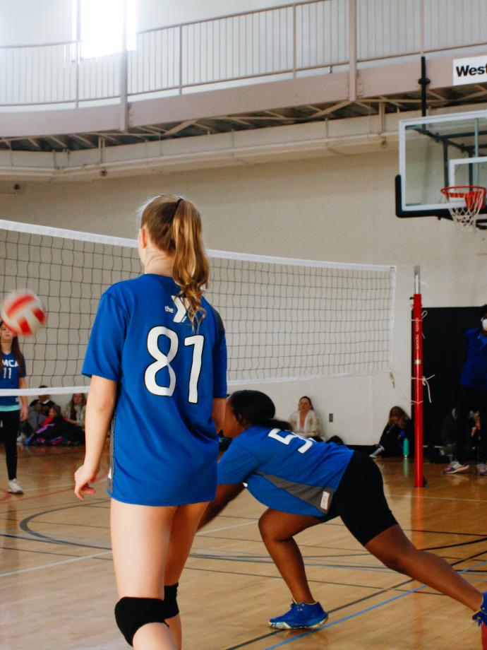 Action shot of volleyball player going for a bump at the YMCA