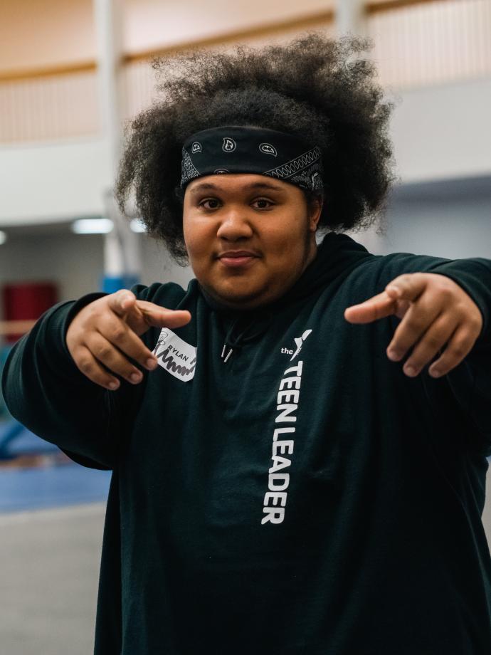 Kids night out teen leader poses for the camera at the YMCA