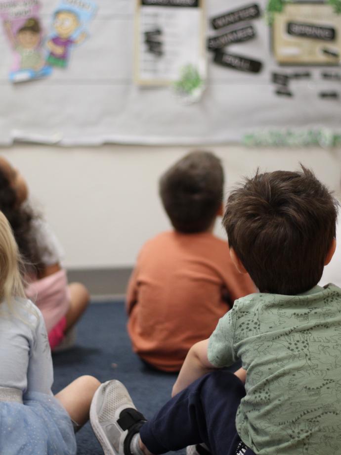 ELC students listening to instruction during reading time at the YMCA early learning center.