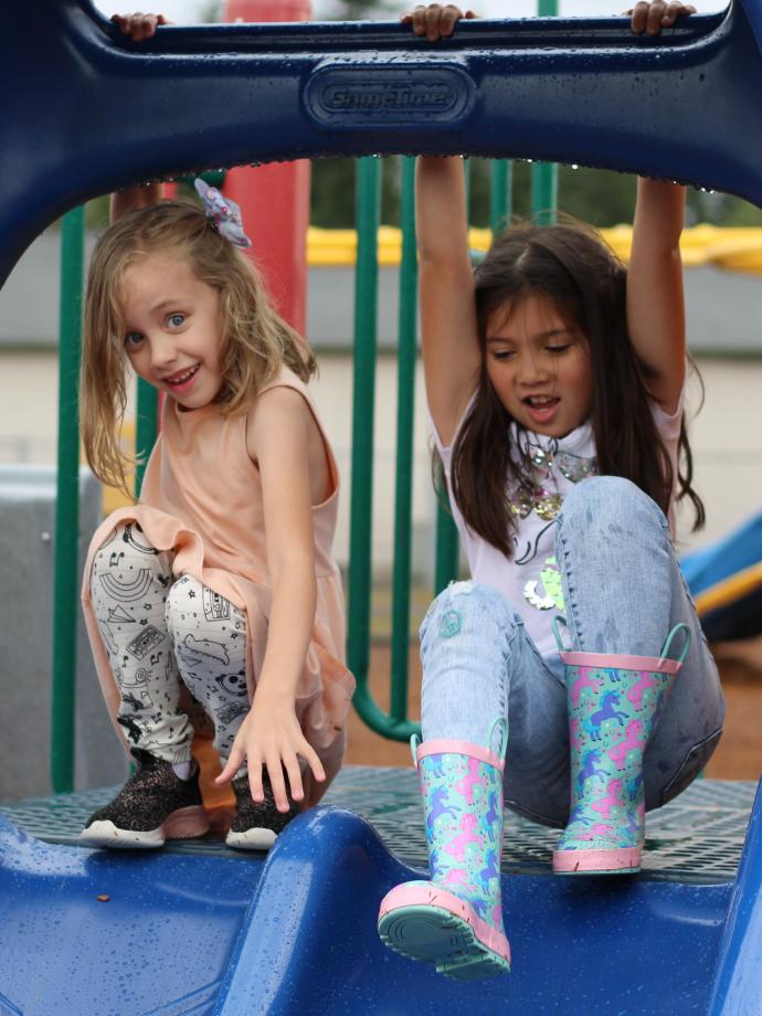 Before and after school care participants about to go down the slide at the YMCA
