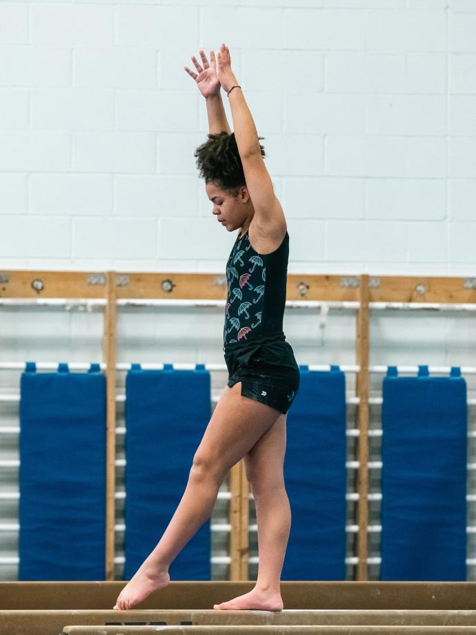 Balancing on Beam in YMCA Private Gymnastics Class