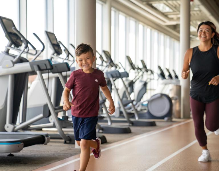 Mother and Son Jogging On The Track