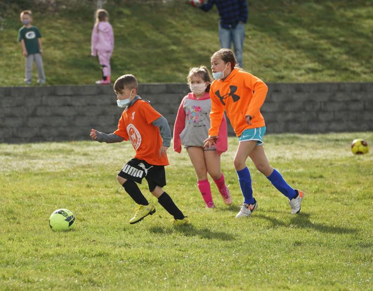 Dribbling Up The Field at YMCA Youth Soccer
