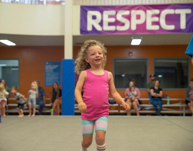 Girl Smiling At Youth Gymnastics