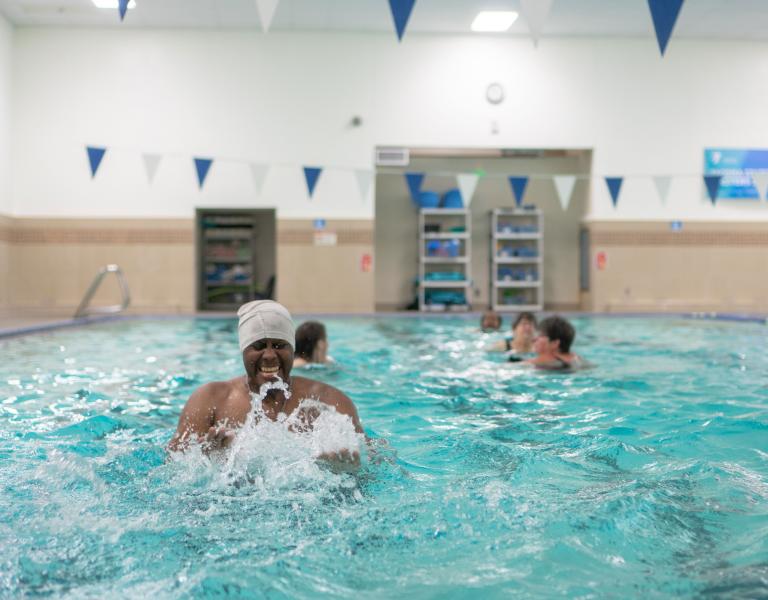 Having Fun In Pool At YMCA Water Fitness Class