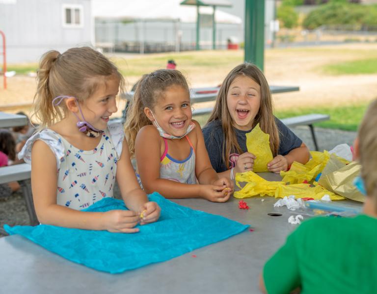 YMCA Summer Day Camp Kids Laughing At Table