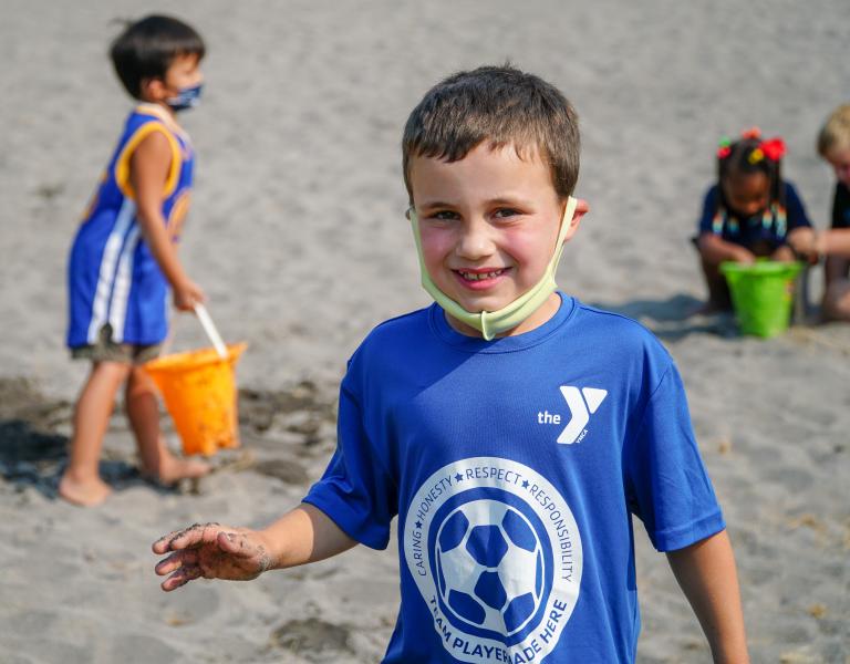 Kids Playing In The Sand At YMCA Summer Day Camp