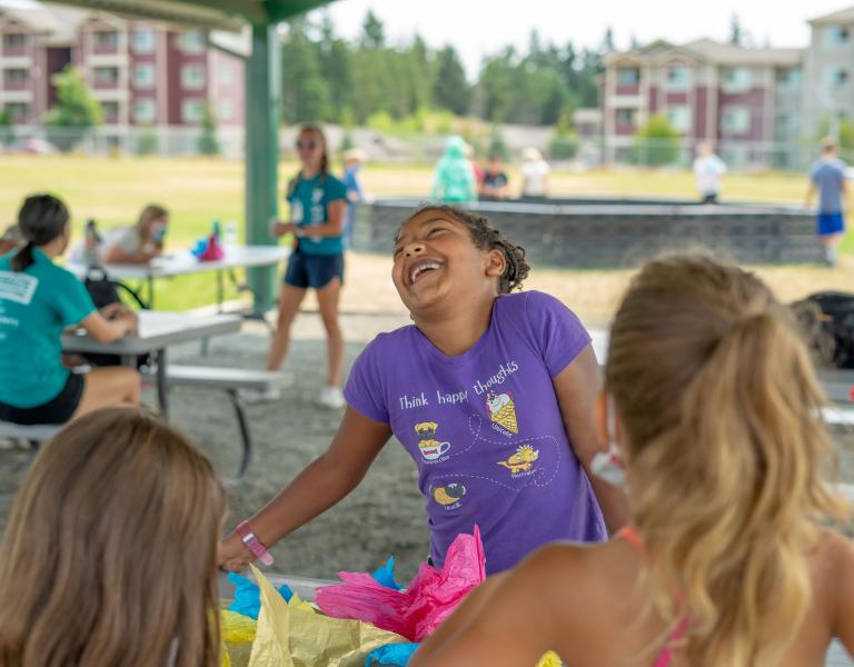 YMCA Summer Day Camps Where Girls Are Having Fun At Table