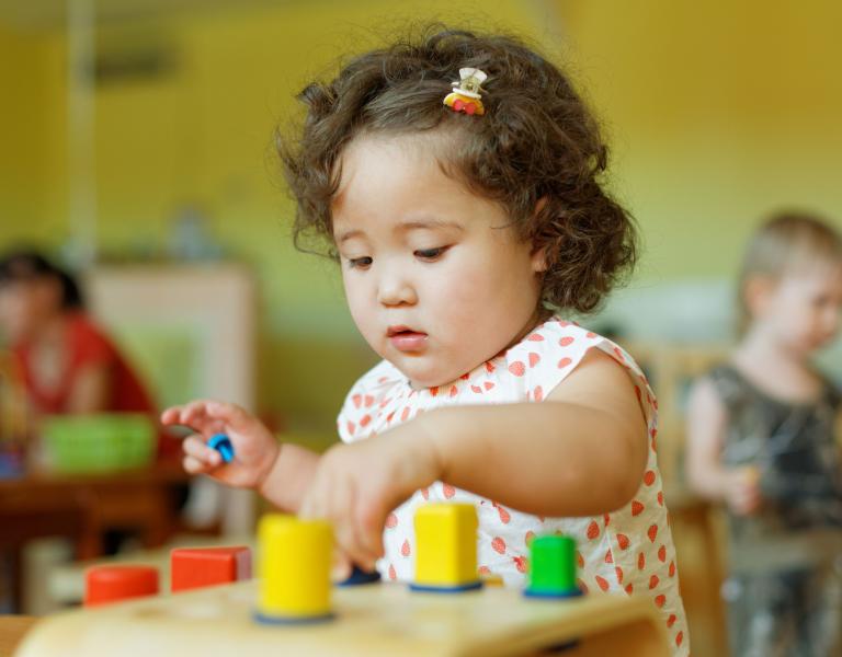  Playing With Colored Blocks At YMCA Child Care