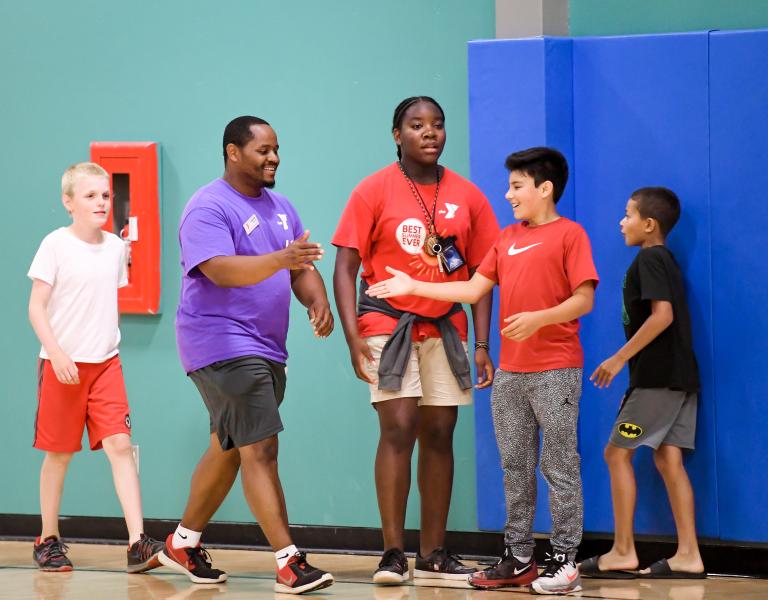 coach and youth member handshake