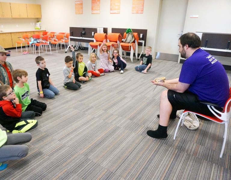 Youth at reptile session of winter break camp