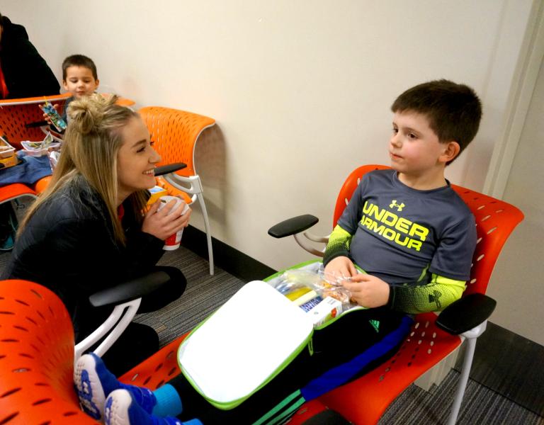 Winter break camp youth and staff enjoying lunchtime