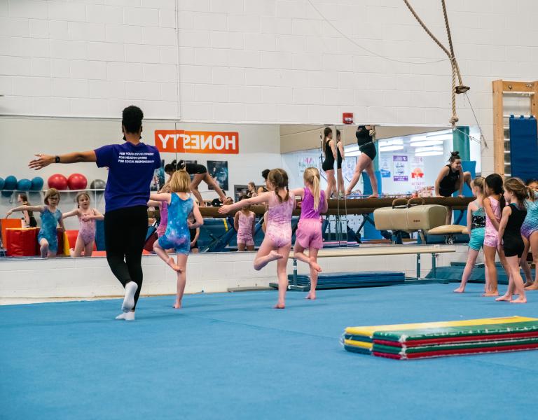 Toddler gym participants learn proper form in the mirror