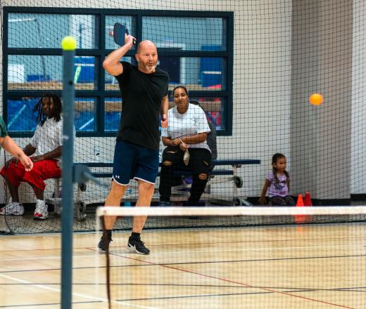 Action shot of pickleball team post swing