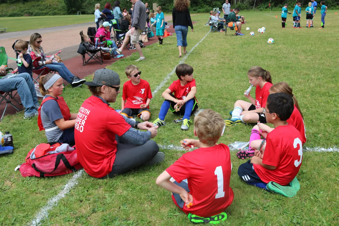 Youth soccer team in a team huddle