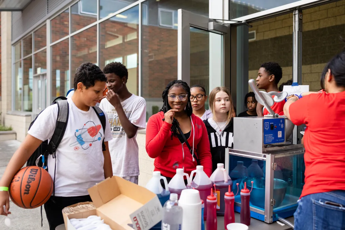 Late nite participants queue up for snow cones at the YMCA