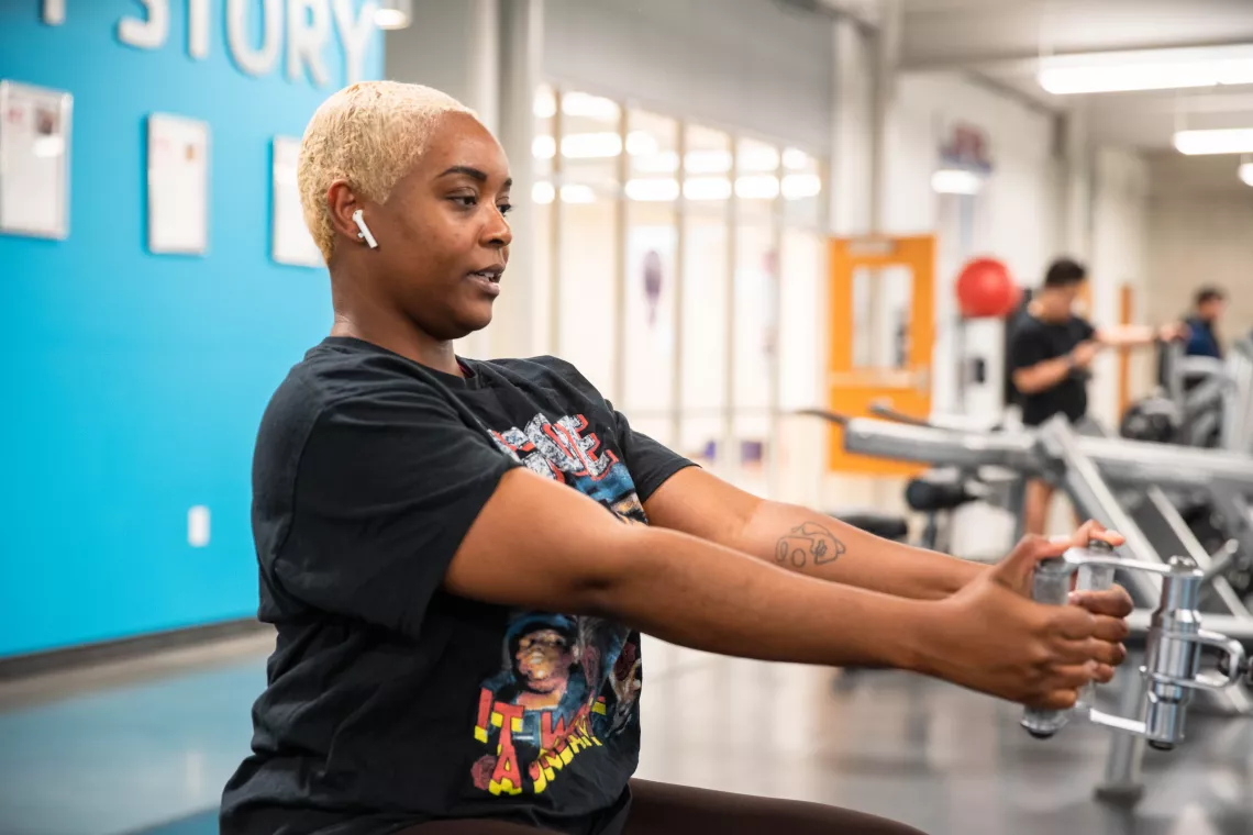 Action shot of a member using the cable row machine at the YMCA