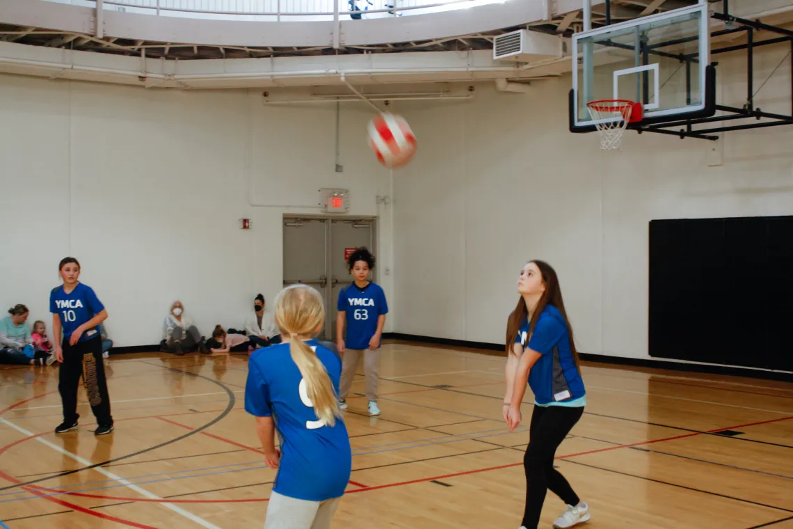 Action shot of a volleyball player getting ready to bump the ball at the YMCA