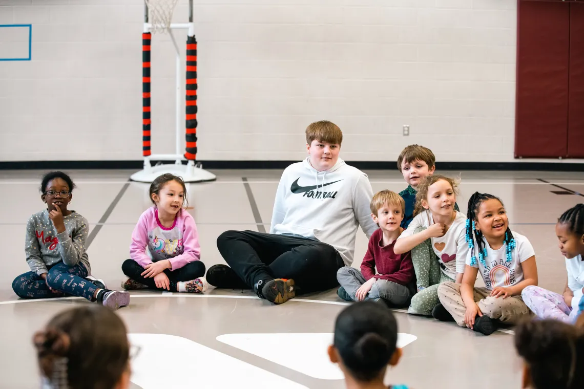 Sitting in Circle at YMCA Break Week Camp
