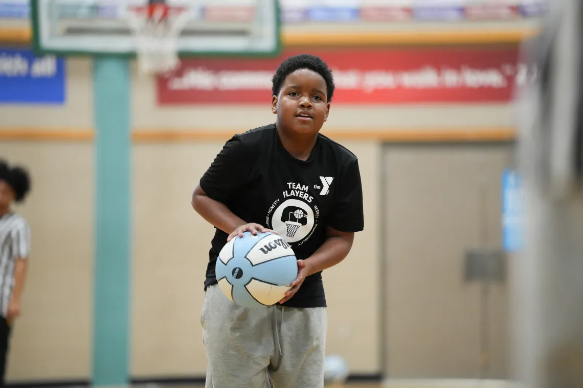 YMCA Youth Basketball Star Shooting a Freethrow