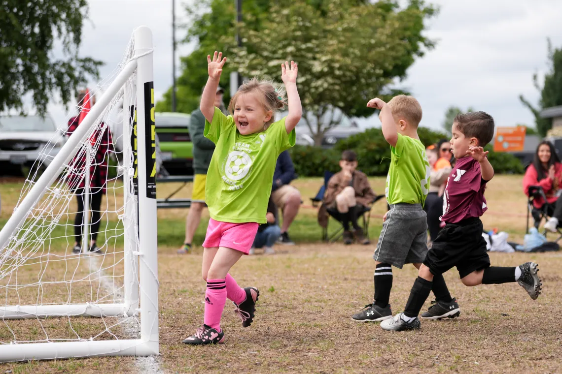 Youth Sports League participant scoring a goal