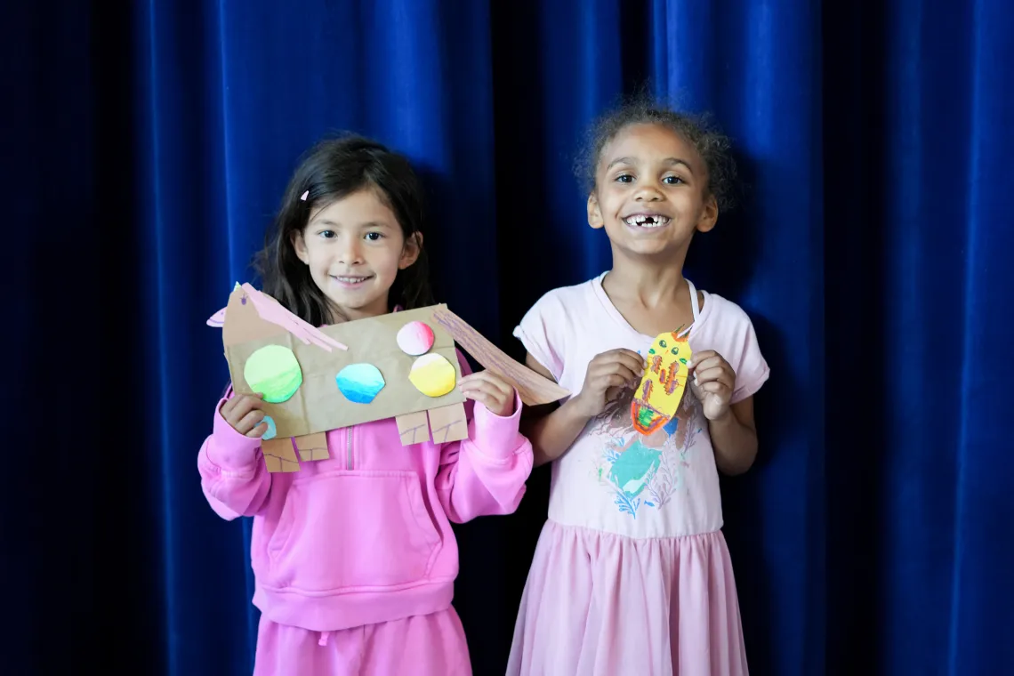 Two Friends Showing Art Work at YMCA Child Care Summer Day Camp