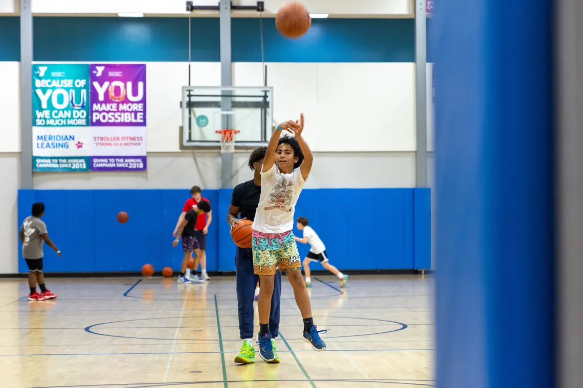 Taking a Basketball Shot at YMCA Late Nite
