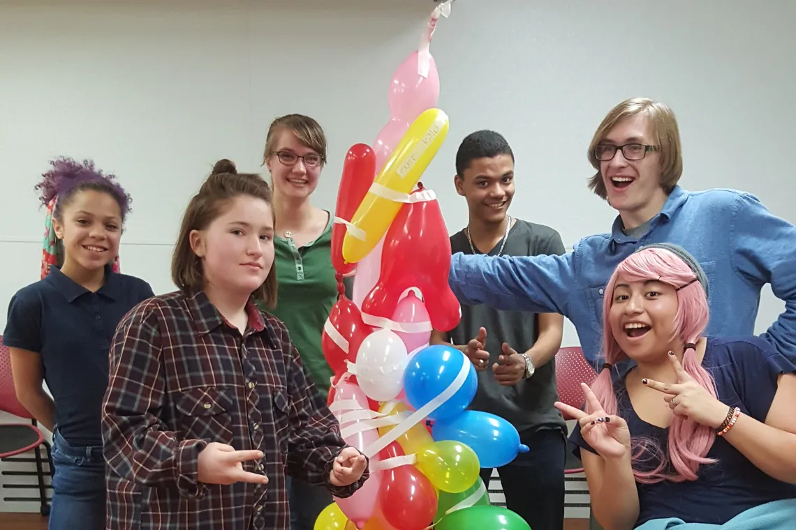 Smiling with Balloon Tree at YMCA Kids Nite Out Leadership Program