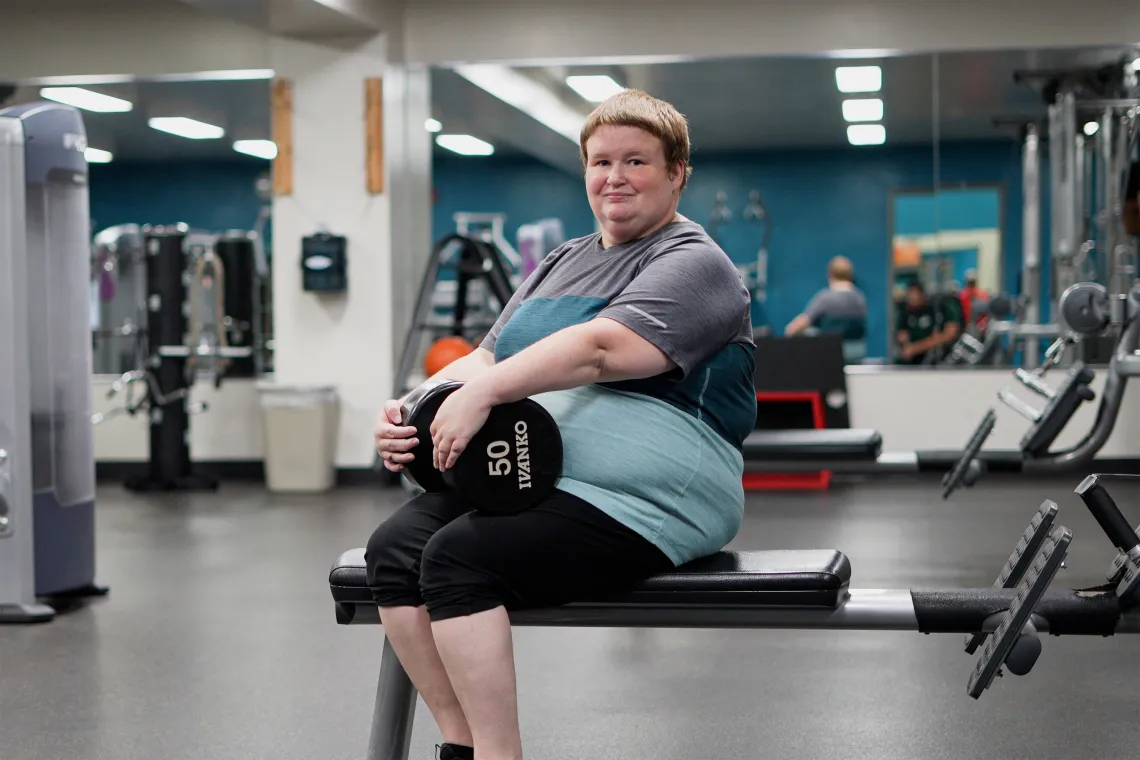 YMCA Member Posing with Dumbbell