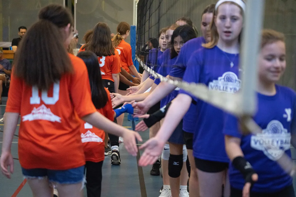 Youth Volleyball Teams Showing Good Sportsmanship