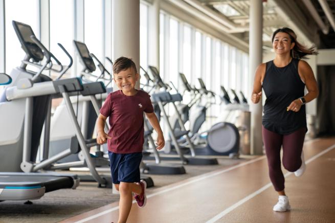 Mother and Son Jogging On The Track