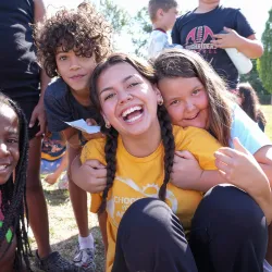 YMCA Summer Camp Counselor Posing with Campers