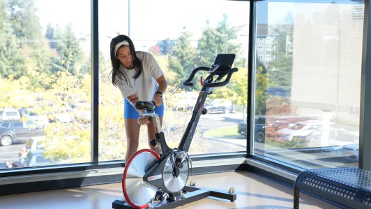 Yadi adjusting an indoor bike