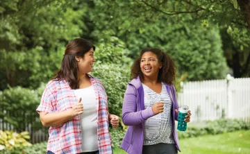 Mother and Daughter Walking Together With YMCA Weight Loss Program