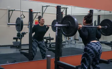 Squat In Mirror At YMCA Training Center
