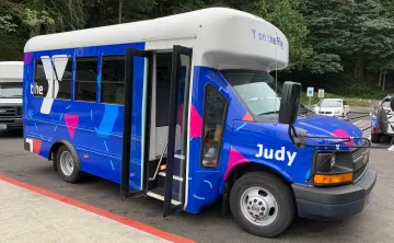 A bus with the name Judy on the side is parked in Tacoma, Washington.