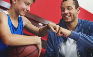 Y staff with basketball participant