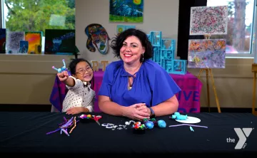 Margee Wilson and Chloe LY smile during a YMCA360 arts video. 