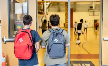 Late nite students enter the doorway of the main gym at the YMCA