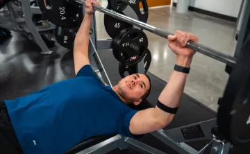 Preparing to Bench Press at YMCA Gym