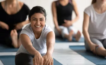 YMCA Young Adult Stretching in Yoga Class