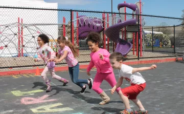 Action shot of Healthy Kids Day participants starting to run the fun run at the YMCA