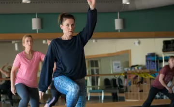 Action shot of a PiYo (Pilates and Yoga) session at the Gordon Family YMCA