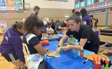 Families gather at the arts booths during Healthy Kids day at the YMCA