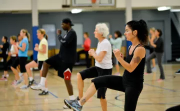 Action shot of a cardio class session at the Y on Pearl Street