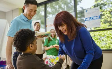 Child being welcomed at the Y