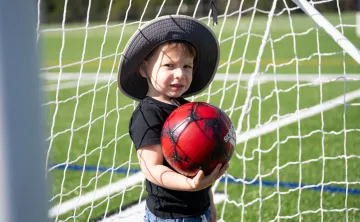 child holding soccer ball