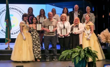 Stef and her cohort with their awards on stage