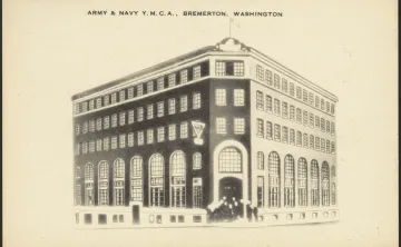 Alt text:  Historic postcard illustration of the Army & Navy YMCA building in Bremerton, Washington, showing a four-story brick structure with large arched windows and the YMCA emblem near the main entrance.