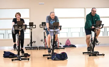 Three Active Older Adults in YMCA Cycling Class